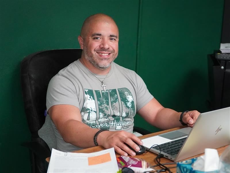 Carlos Soto at desk